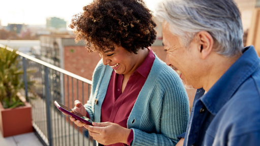 Two people looking at phone