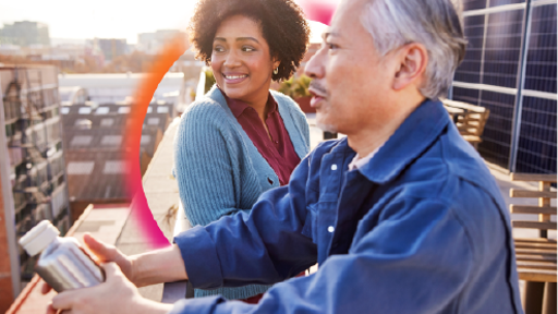 Two people looking out over a city