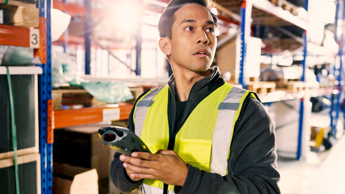 Photo of a warehouse worker with barcode reader