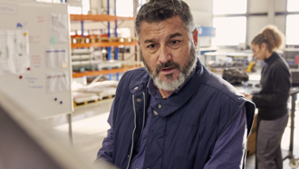 Man with a beard at table