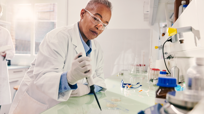 Two scientist in a lab taking notes