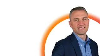 Ian Coffey in front of white background with orange half circle outline graphic