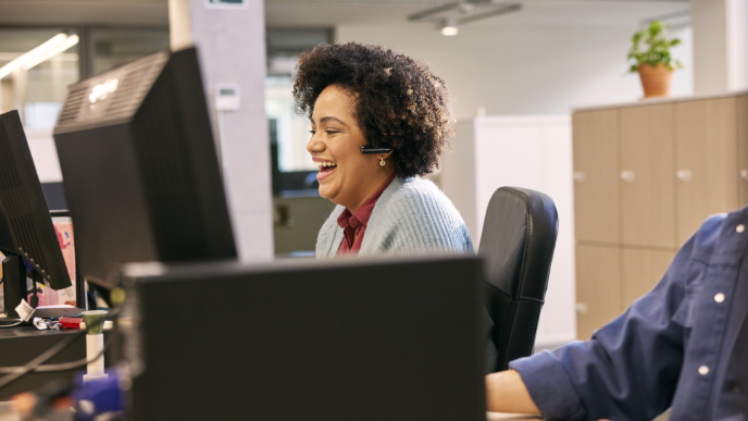 Lady sitting at desk at call center