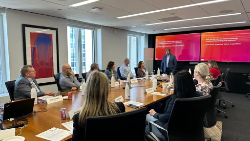 Photo of a conference room with a presenter