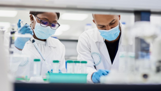 Two scientist in a lab doing tests