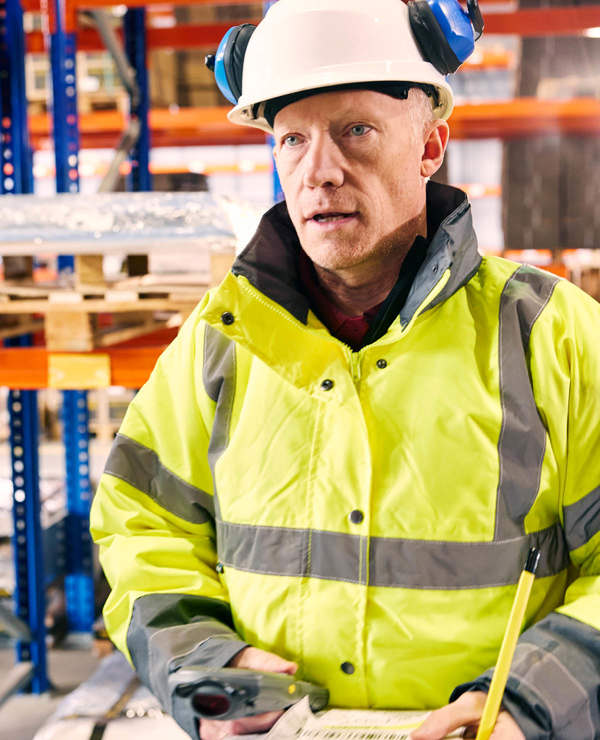 Man in hardhat and yellow coat