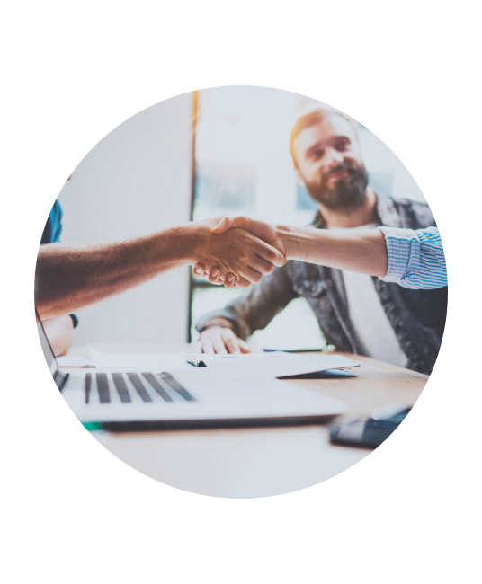 Handshake over a laptop