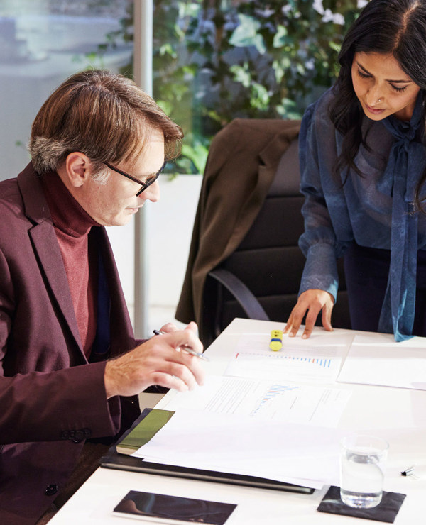 Two colleagues working at a table