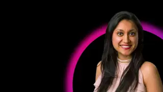 Hema Morjaria in front of black background with pink and purple half circle graphic