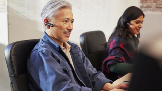 Man in conference room with ear piece