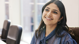 Smiling woman sitting at desk